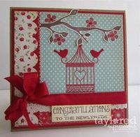 Red and teal. Be still my heart... note the flowers and cage are stamped directly on the patterned paper.